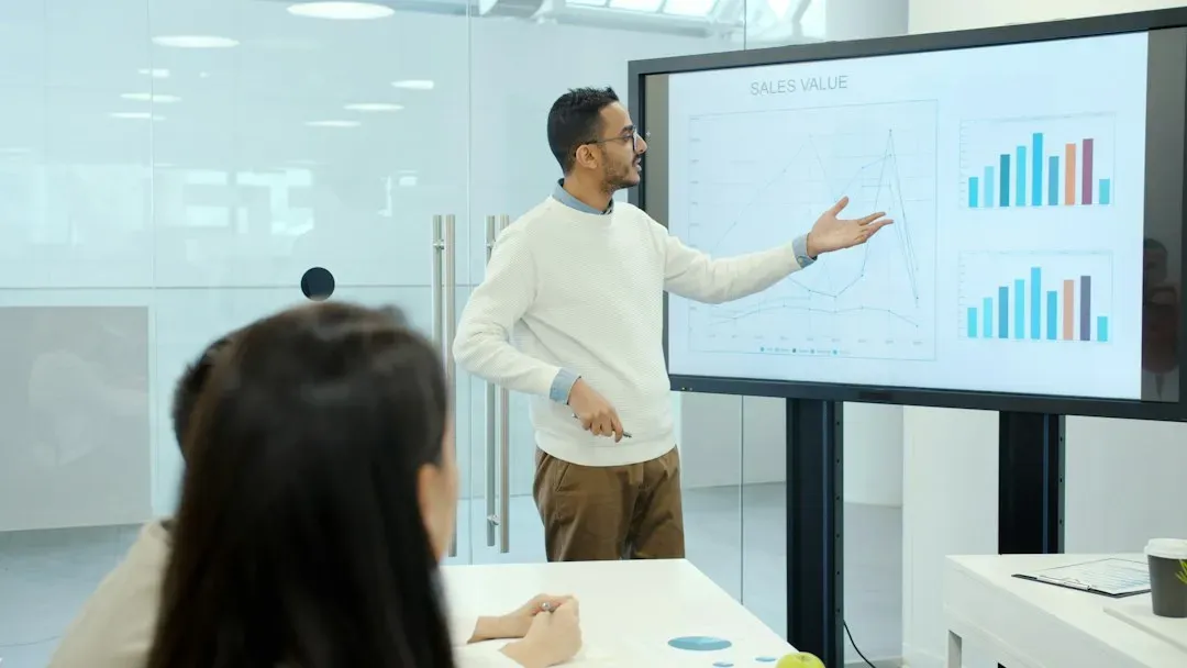 Consultant presenting a data dashboard to a client - content marketing consulting services